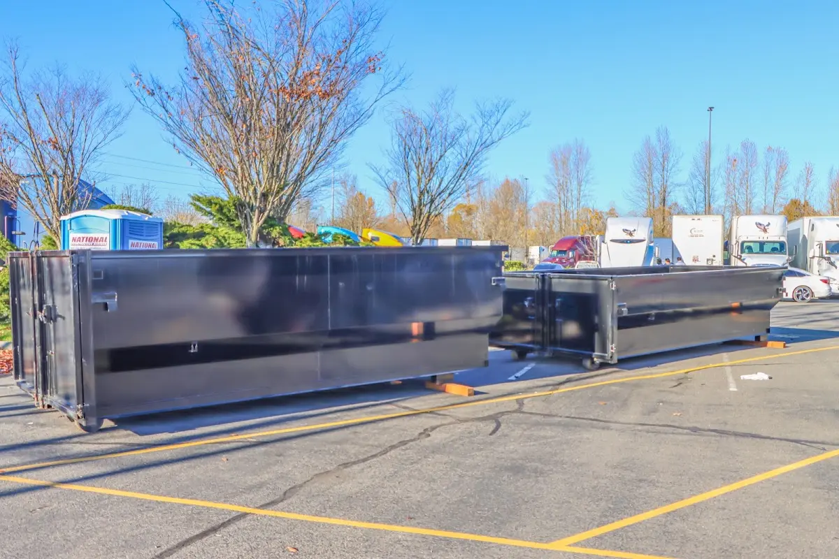 Professional dumpster rental service with roll-off container on residential driveway in Orlando